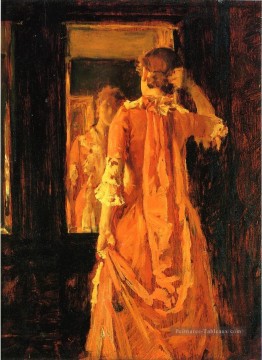 Jeune femme devant un miroir William Merritt Chase Peinture à l'huile